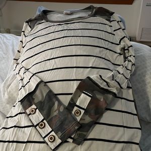 Striped front with cameo back . Cute button details on sleeve.